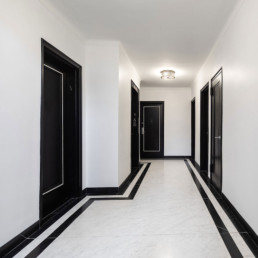 Hallway Renovations: Wallcovering vs. Paint. Which is Better for Your Apartment Building?